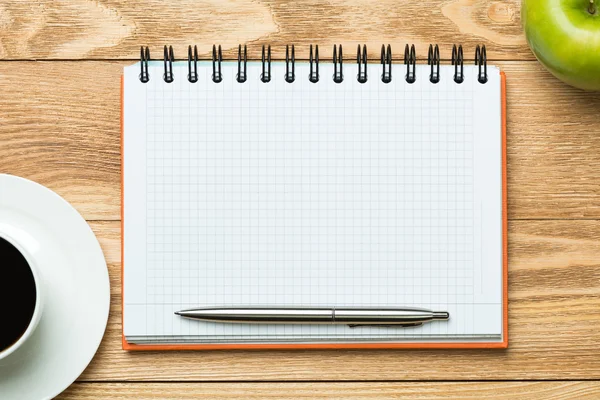 Paper with cup of coffee ,apple and pen — Stock Photo, Image