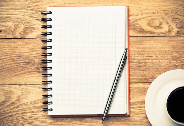 Blank with cup of coffee and pen — Stock Photo, Image