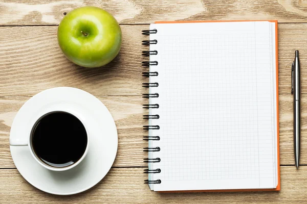 Paper with cup of coffee ,apple and pen — Stock Photo, Image