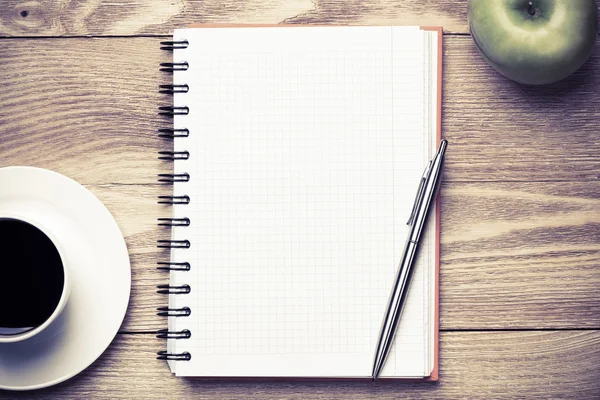 Paper with cup of coffee ,apple and pen — Stock Photo, Image