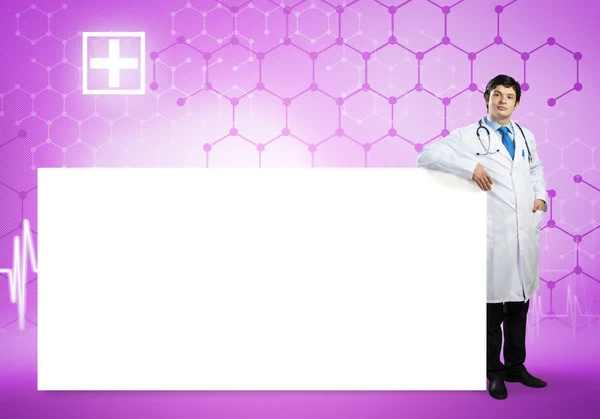 Male doctor with blank banner — Stock Photo, Image