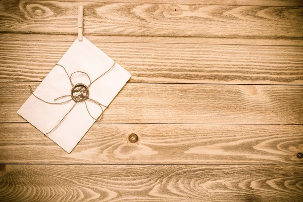 Envelope hanging on rope — Stock Photo, Image