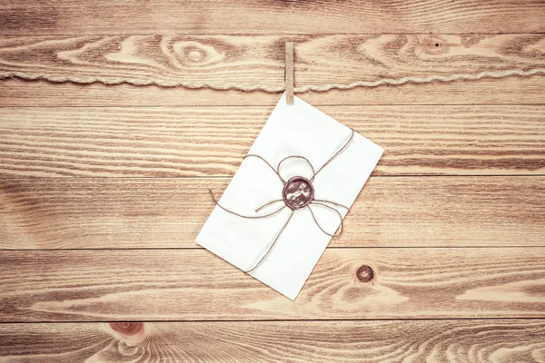 Envelope hanging on rope — Stock Photo, Image