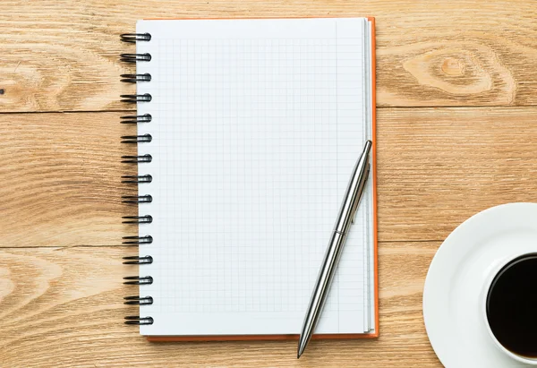 Blank with cup of coffee and pen — Stock Photo, Image