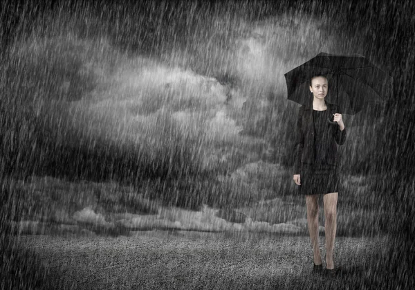 Young businesswoman with umbrella — Stock Photo, Image