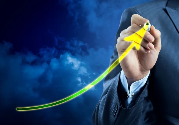 Businessman drawing growing graph — Stock Photo, Image