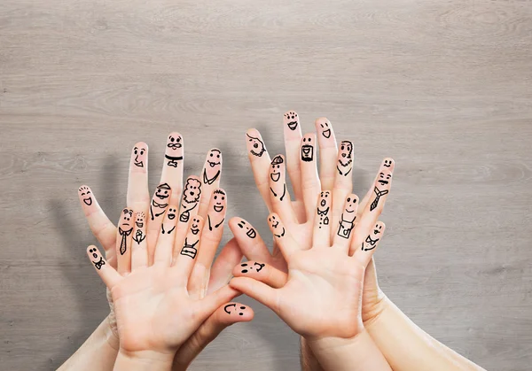 Mani di famiglia con volti — Foto Stock