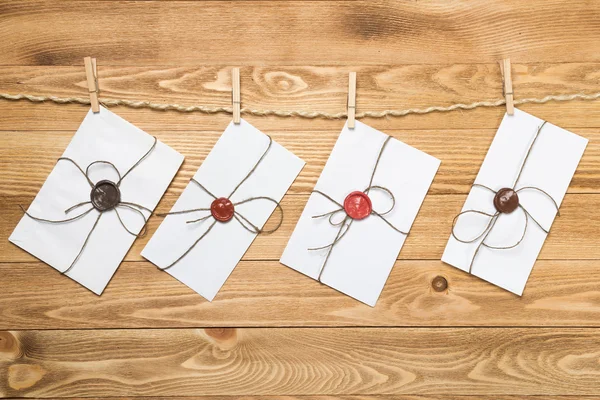 Envelopes hanging on ropes — Stock Photo, Image