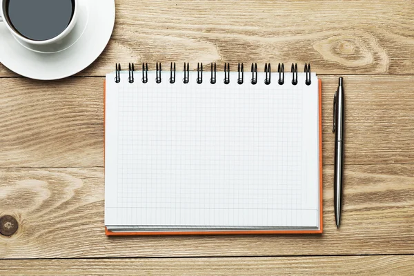 Blank with cup of coffee and pen — Stock Photo, Image