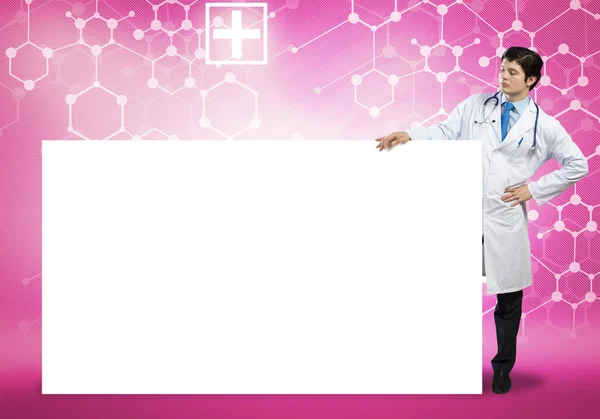 Male doctor with blank banner — Stock Photo, Image