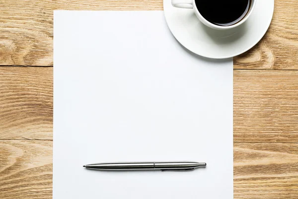 Blank with cup of coffee and pen Royalty Free Stock Images