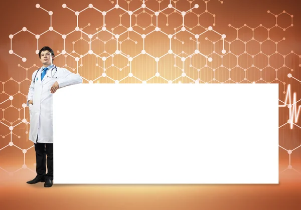 Male doctor with blank banner — Stock Photo, Image