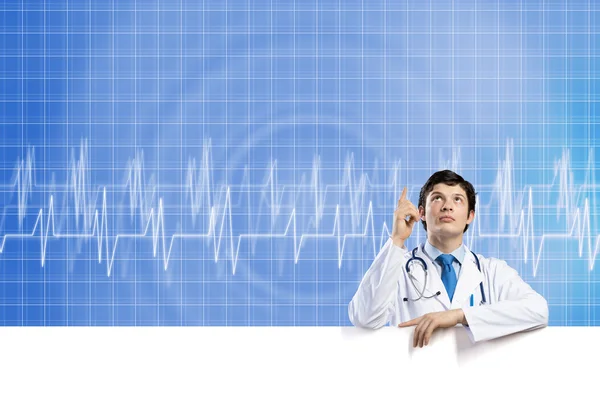 Doctor with white blank banner — Stock Photo, Image