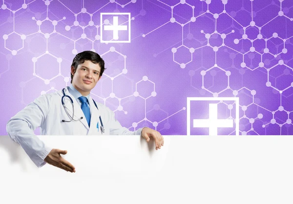 Doctor with white blank banner — Stock Photo, Image