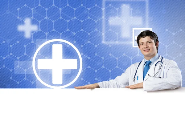 Doctor with white blank banner — Stock Photo, Image