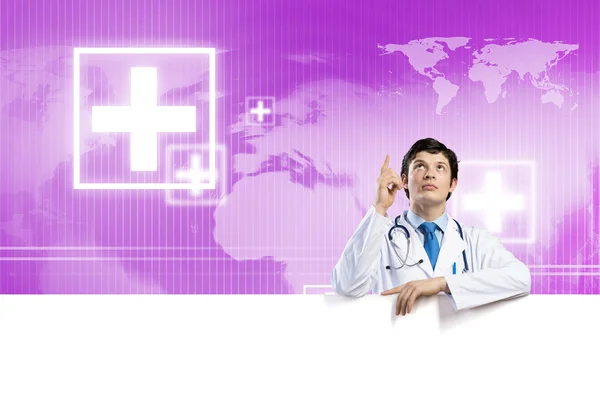 Doctor with white blank banner — Stock Photo, Image