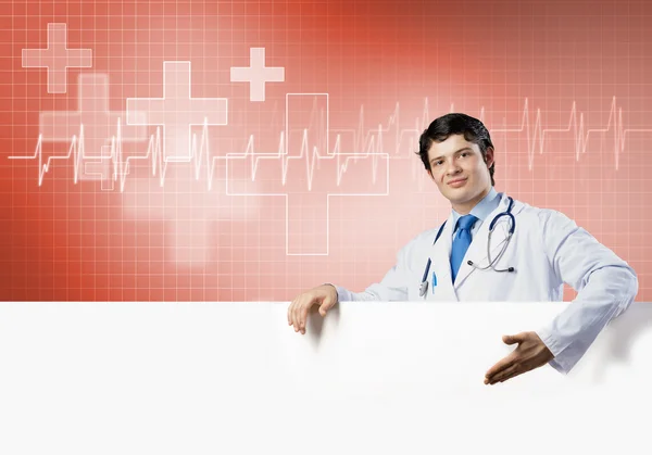 Doctor with white blank banner — Stock Photo, Image