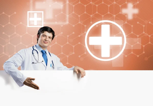 Doctor with white blank banner — Stock Photo, Image