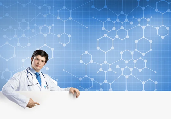 Doctor with white blank banner — Stock Photo, Image