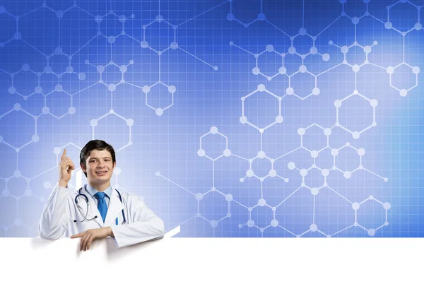 Doctor with white blank banner — Stock Photo, Image