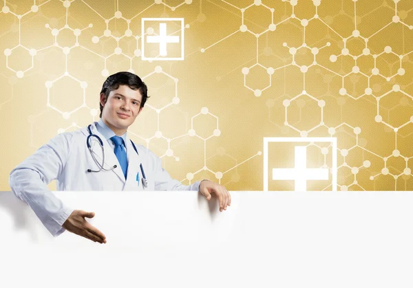 Læge med hvidt blankt banner - Stock-foto