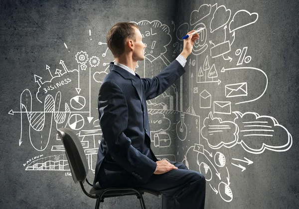 Businessman drawing business strategy — Stock Photo, Image