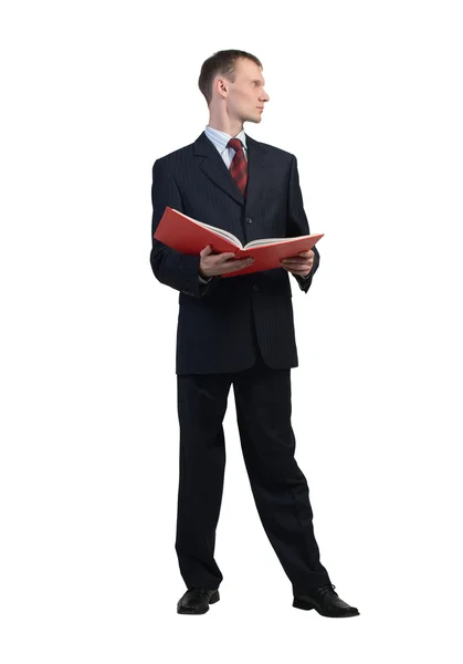 Businessman reading red book — Stock Photo, Image