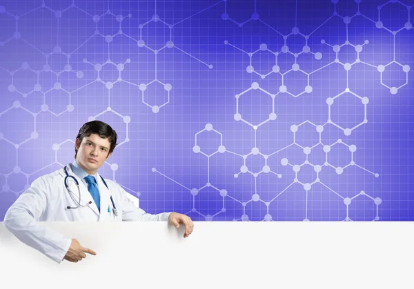 Doctor with white blank banner — Stock Photo, Image