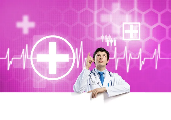 Doctor with white blank banner — Stock Photo, Image