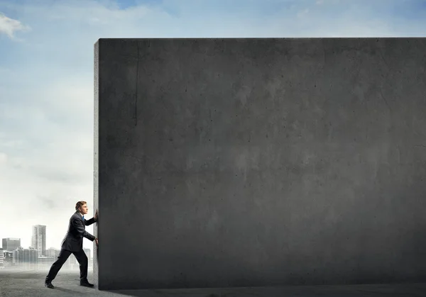 Businessman push wall — Stock Photo, Image