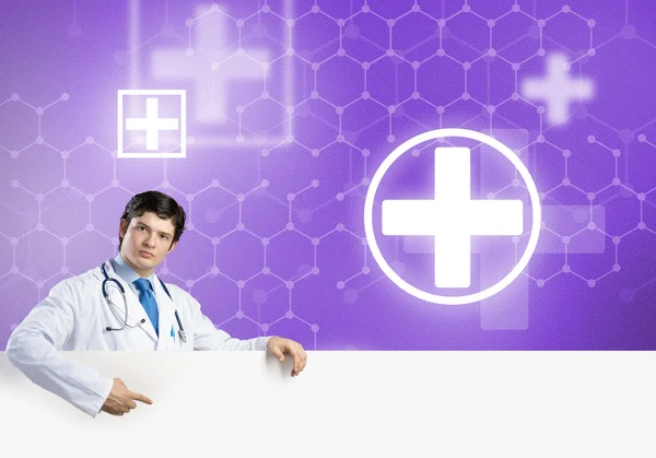 Doctor with white blank banner — Stock Photo, Image