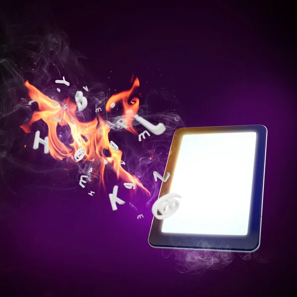 tablet computer burning in fire flames