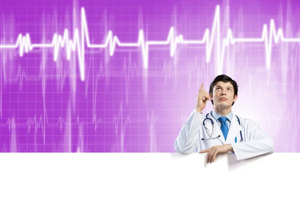 Doctor with white blank banner — Stock Photo, Image