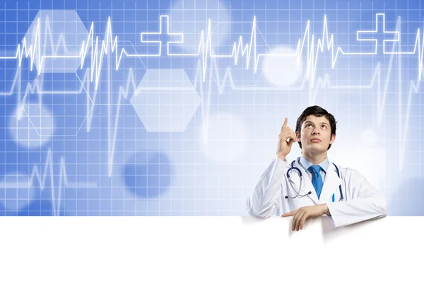 Doctor with white blank banner — Stock Photo, Image