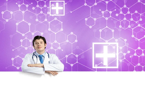 Doctor with white blank banner — Stock Photo, Image