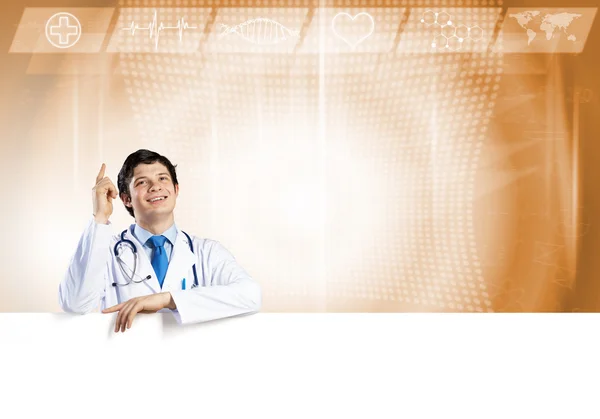 Doctor with white blank banner — Stock Photo, Image