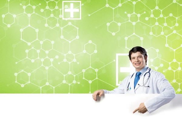 Doctor with white blank banner — Stock Photo, Image