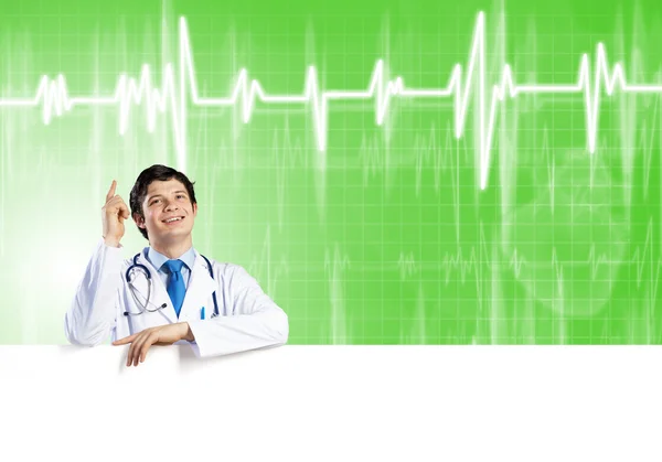 Doctor with white blank banner — Stock Photo, Image