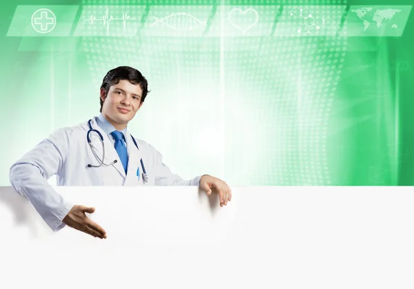 Doctor with white blank banner — Stock Photo, Image