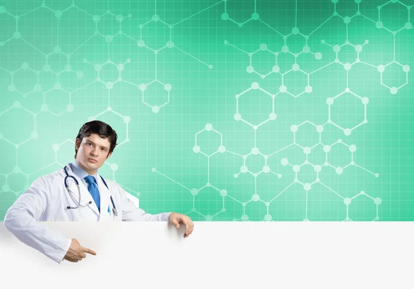 Doctor with white blank banner — Stock Photo, Image