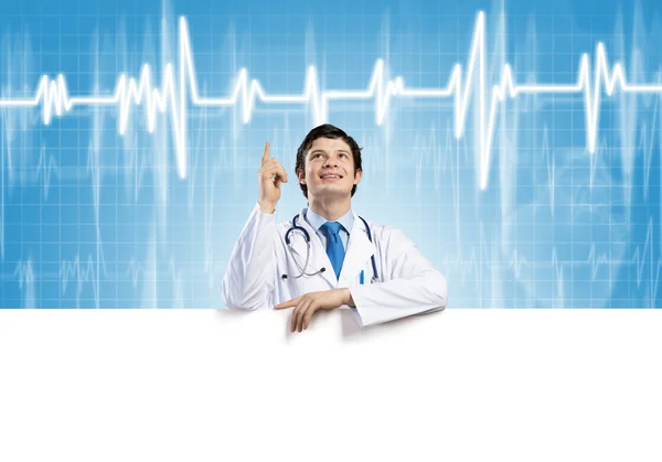 Doctor with white blank banner — Stock Photo, Image