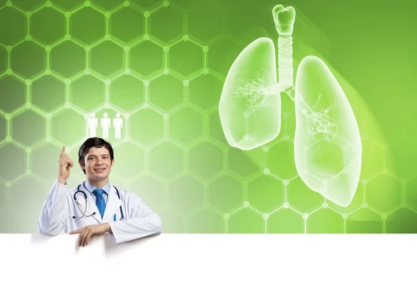 Doctor with white blank banner — Stock Photo, Image