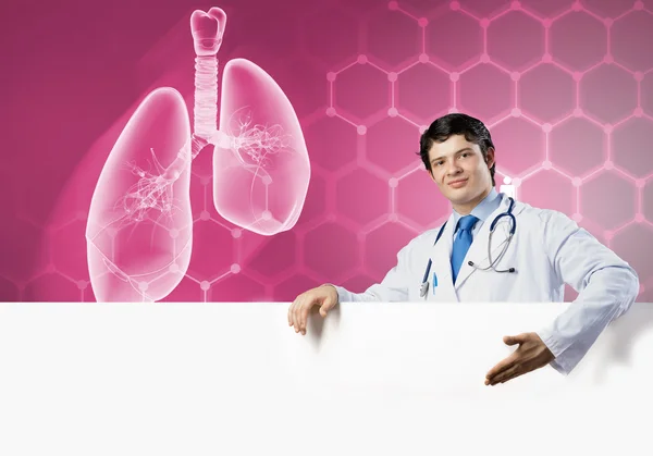 Doctor with white blank banner — Stock Photo, Image