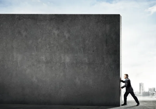 Businessman push wall — Stock Photo, Image