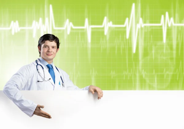 Doctor with white blank banner — Stock Photo, Image