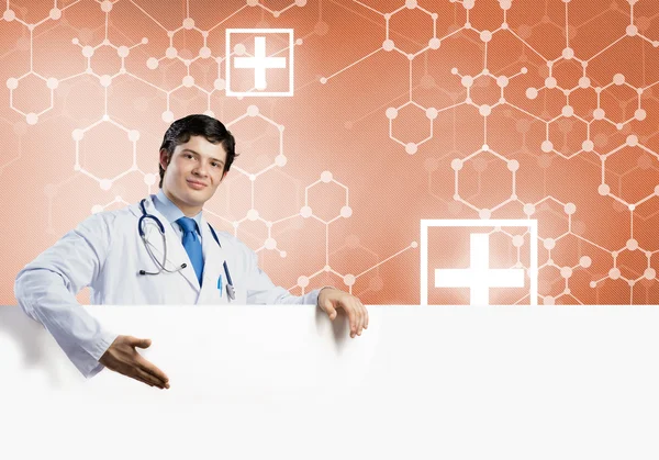 Doctor with white blank banner — Stock Photo, Image