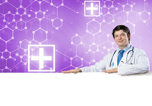 Doctor with white blank banner — Stock Photo, Image