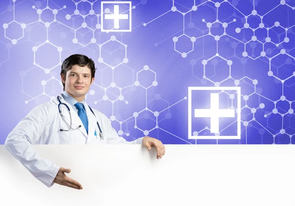 Doctor with white blank banner — Stock Photo, Image