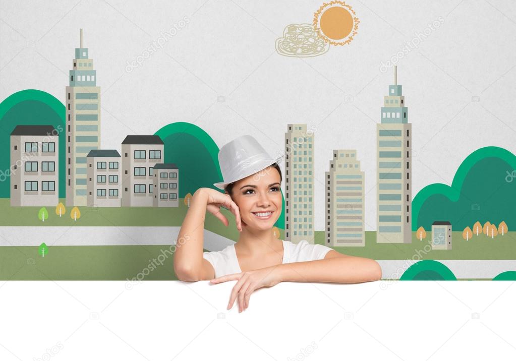 Woman in hat with blank white banner