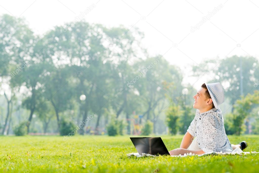 young man working in park  